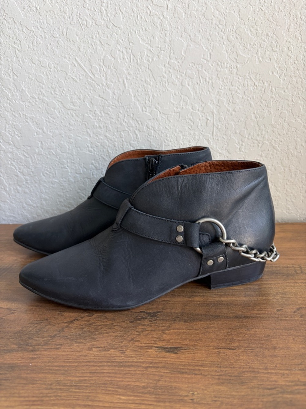 Sixtyseven Black Leather Ankle Booties with Chain Accent